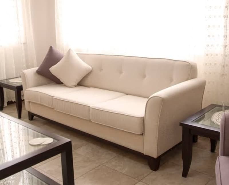 upholstered sofa with tufted detailing