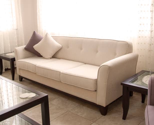 upholstered sofa with tufted detailing